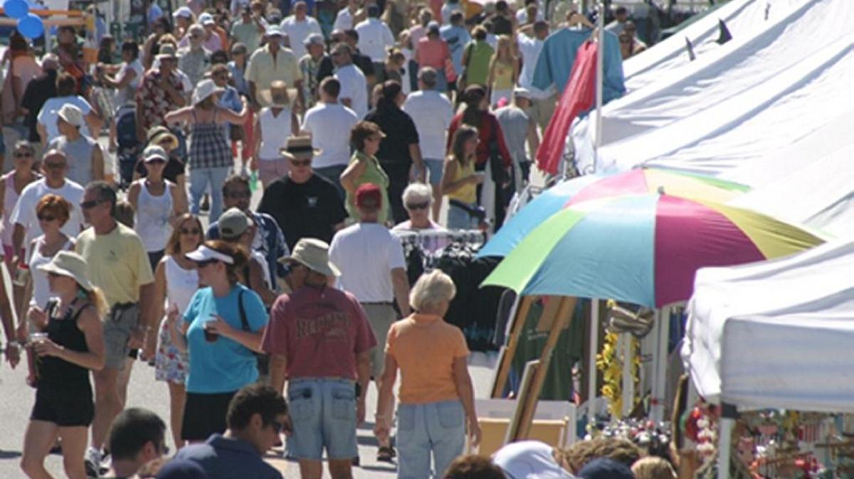 The crowd walks along Pine Avenue during a past Bayfest on Anna Maria Island.