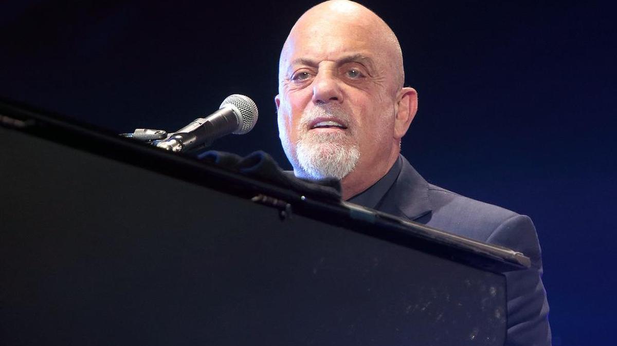 In this July 25, 2015, file photo, singer-songwriter Billy Joel performs in concert at M&T Bank Stadium in Baltimore. Fans watching a Billy Joel tribute band were treated to a surprise appearance by the Piano Man himself. Joel was in the audience Friday night, June 24, 2016, with his wife, Alexis Roderick, at a show in Huntington, New York, when he decided to join the band Big Shot for a three-song set.