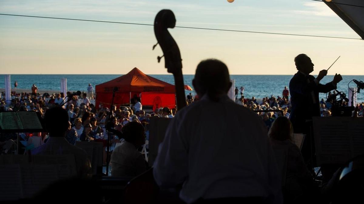 The Anna Maria Island Concert Chorus & Orchestra performs for hundreds of guests during the Symphony on the Sand performance on Saturday evening, November 12, 2016 at Coquina Beach on Anna Maria Island.
