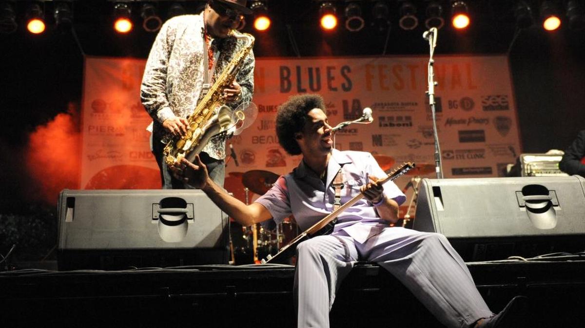 Selwyn Birchwood performs with his band at the Blues Appetizer concert in 2012 at the Riverwalk Pavilion. At left is saxophonist Donald Huff Wright.