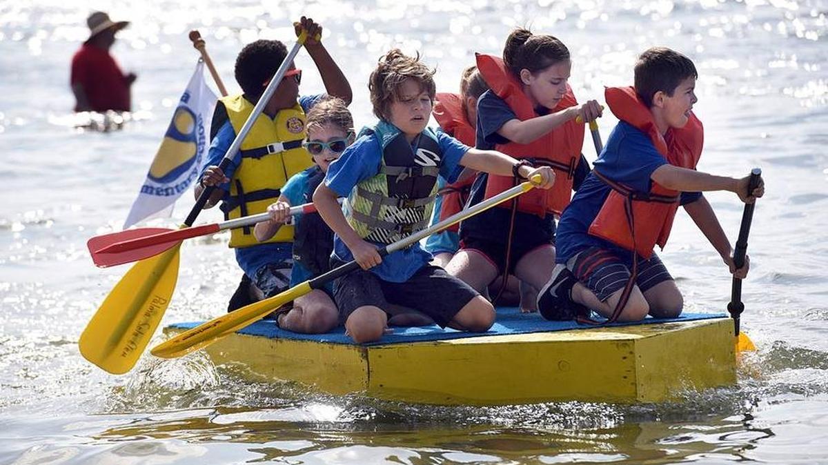 Palma Sola Elementary students paddle to win at last year’s annual DeSoto Heritage Festival’s Bottle Boat Regatta at Palma Sola Causeway. This year’s event is Saturday.