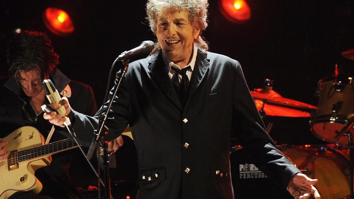 In this Jan. 12, 2012, file photo, Bob Dylan performs in Los Angeles. Dylan was named the winner of the 2016 Nobel Prize in literature Thursday, in a stunning announcement that for the first time bestowed the prestigious award to someone primarily seen as a musician.