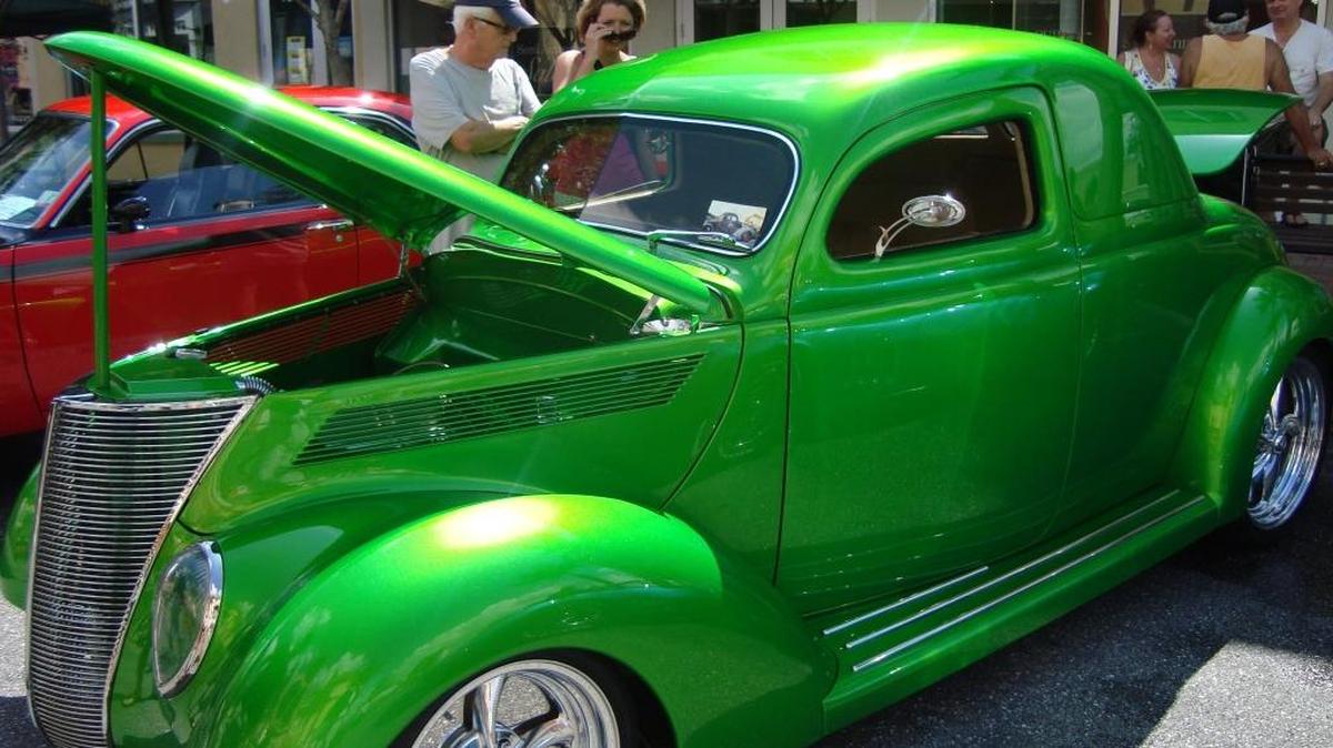 Visitors check out the classic cars at a past Suncoast Powerboat Grand Prix Car Show in Lakewood Ranch.