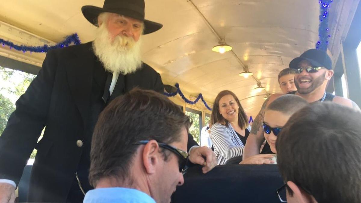 Wild West reenactor Greg Clarke, left, playing U.S. Marshal Israel Dailey, interacts with the Robinson and Tarjanyi families during a past Florida Railroad Museum train adventure called, “Hole in the Head Gang.” The gang is in action again this weekend.
