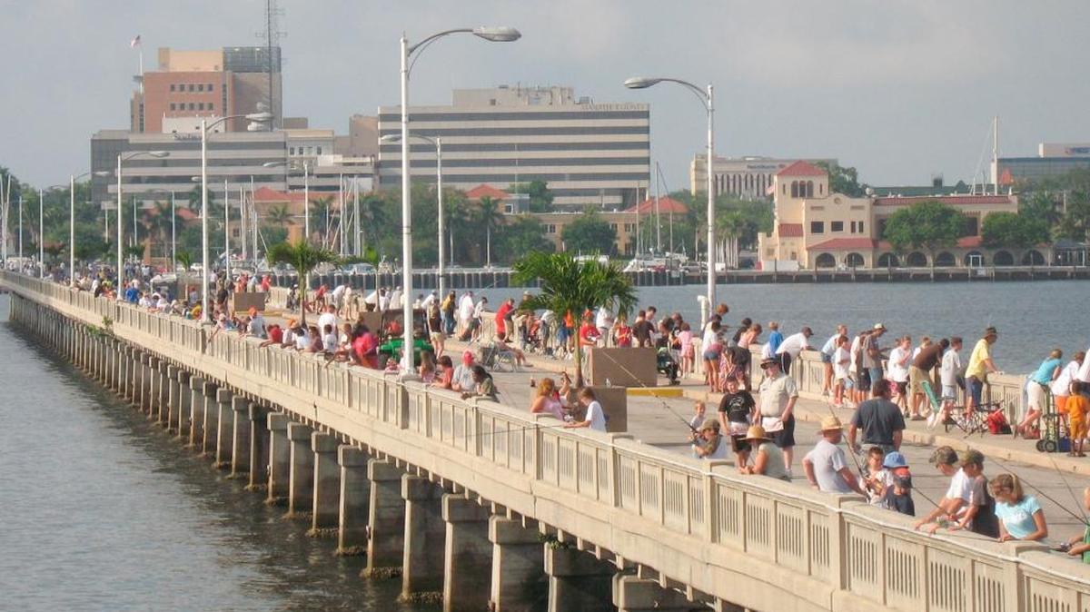 Young anglers, line the Green Bridge fishing pier at a past Jerry Hill Memorial Kids Fishing Tournament. Registration for this year’s tournament begins at 7 a.m. Saturday.