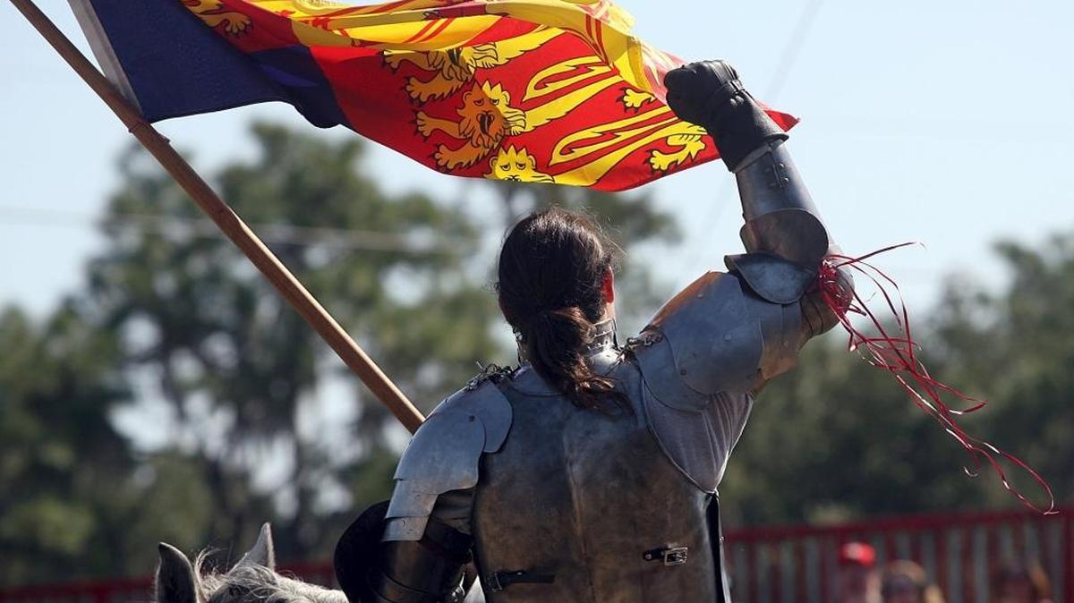 “Sir Theodore” pumps his fist in victory during the Knights of Valour jousting at the Sarasota Medieval Fair in 2007. 