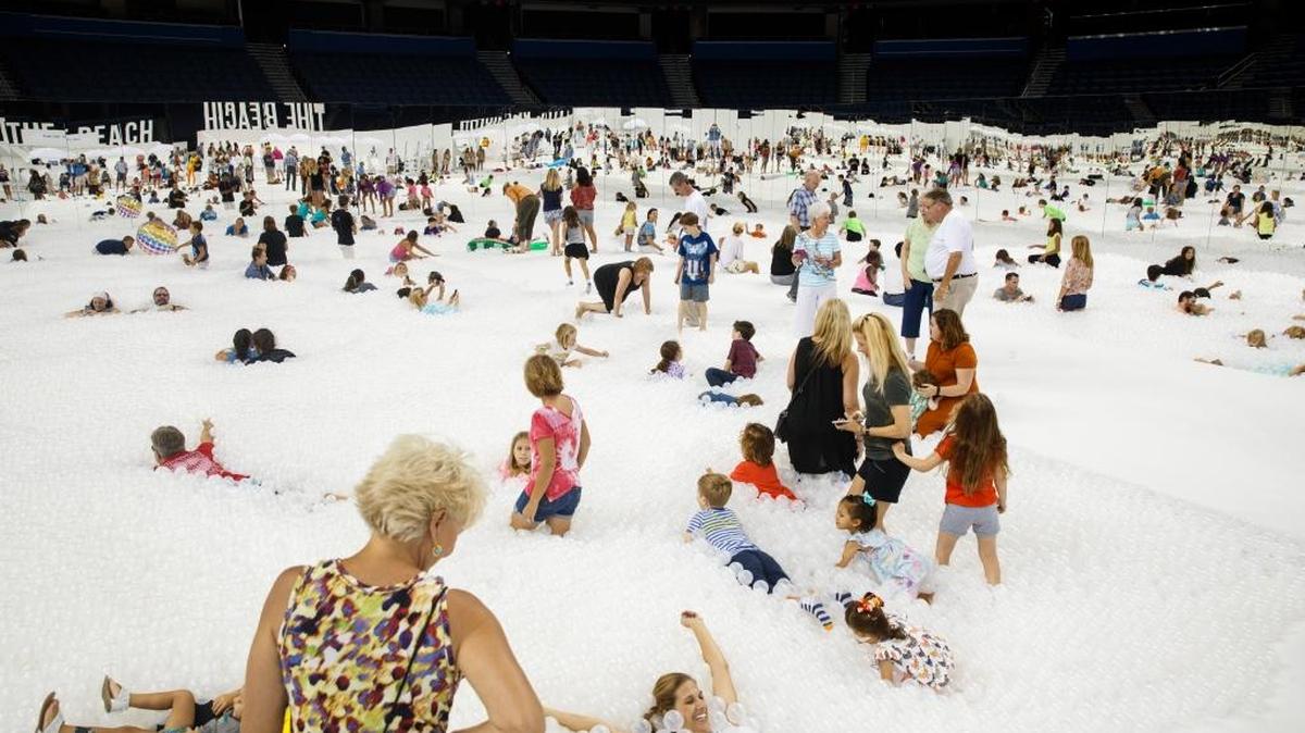 The Beach Tampa is a 15,000-square-foot immersive environment featuring an ocean of 1.2 million recyclable and antimicrobial white balls. The free attraction runs through Aug. 25 at Amalie Arena.