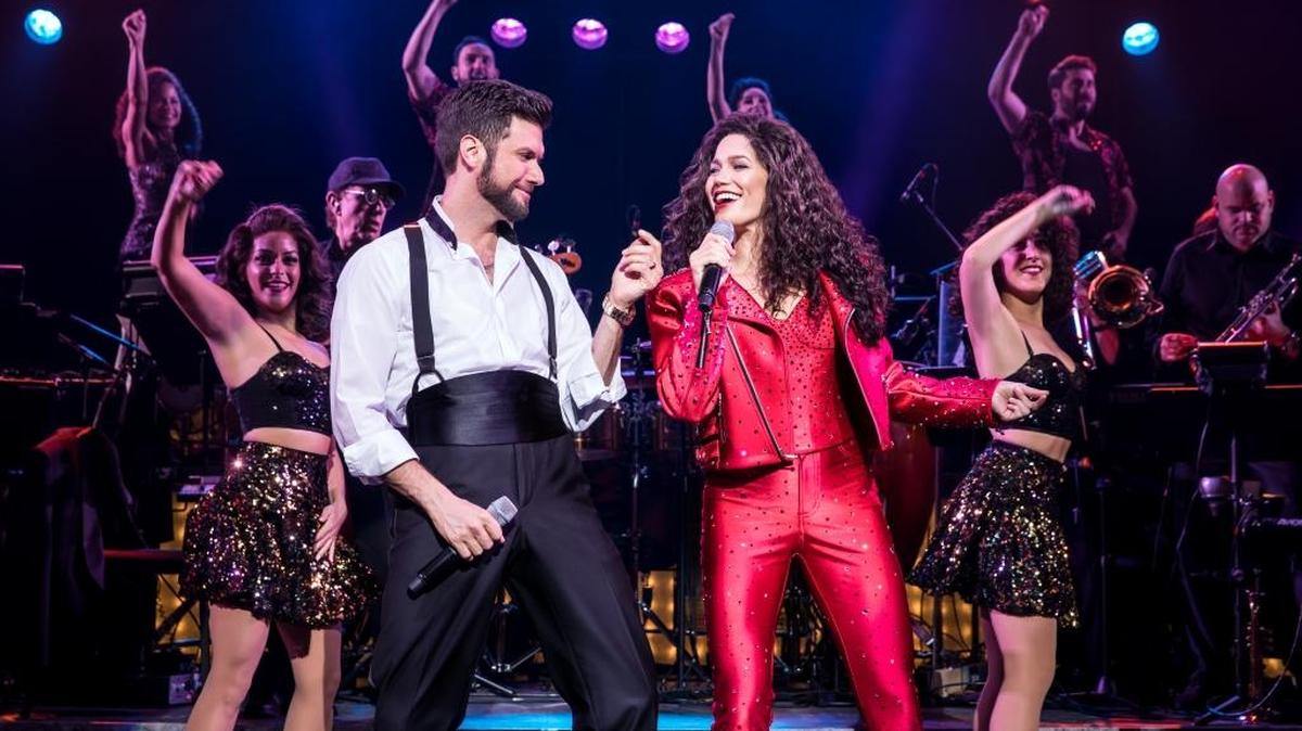 Mauricio Martinez plays the role of Emilio Estefan and Christie Prades stars as Gloria Estefan in “On Your Feet!”