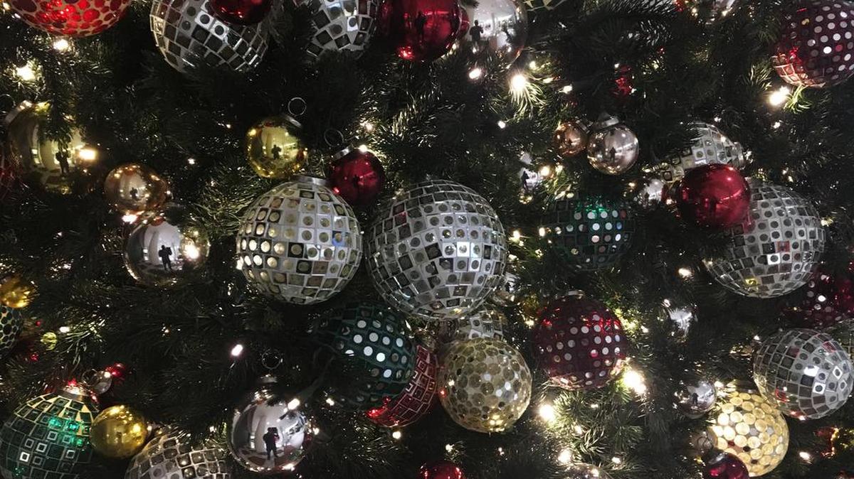 In this Friday, Dec. 1, 2017, photo, ornaments hang on a Christmas tree on display in New York. (AP Photo/Swayne B. Hall)