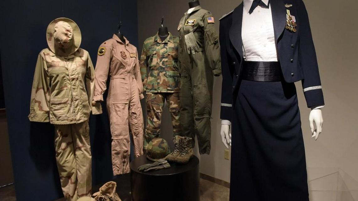 A grouping of Air Force uniforms are part of a women's uniform exhibit comprised mostly of uniforms from locals at State College of Florida's Neel Auditorium gallery.