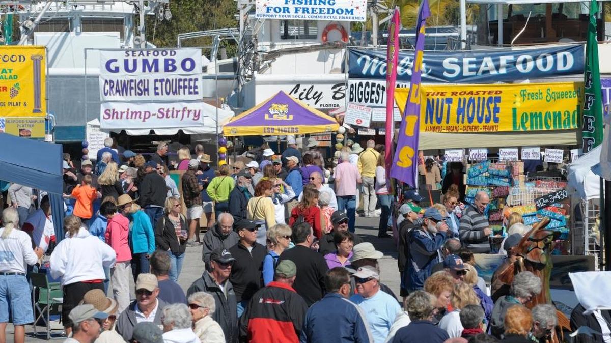 Crowds stroll past the food and craft vendors at the 33rd Annual Cortez Commercial Fishing Festival.
