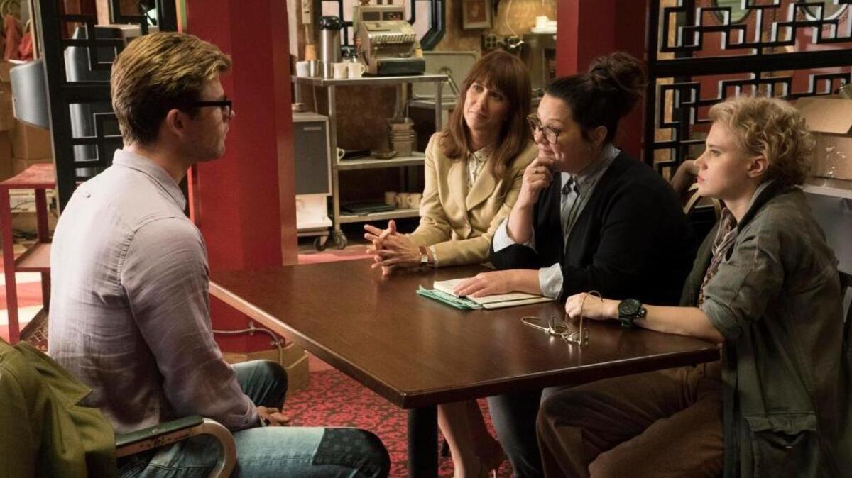 From left, Chris Hemsworth, Kristen Wiig, Melissa McCarthy and Kate McKinnon appear in a scene from “Ghostbusters.”