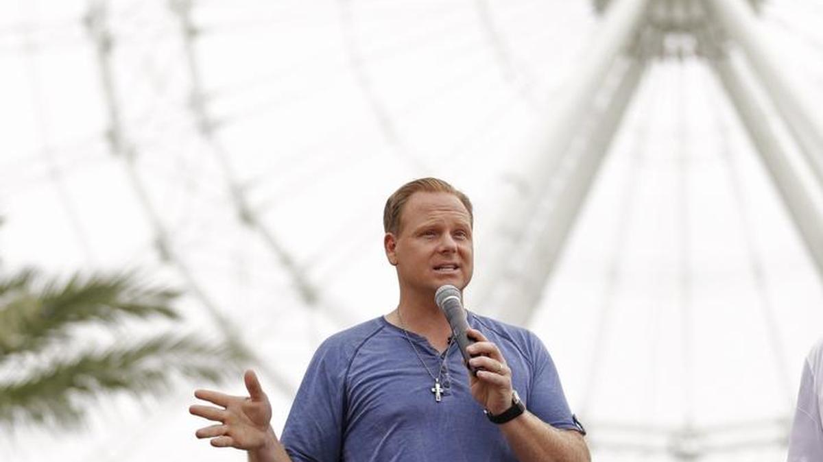 In this April 27, 2015 file photo, Nik Wallenda answers questions at a news conference in front of the Orlando Eye in Orlando.