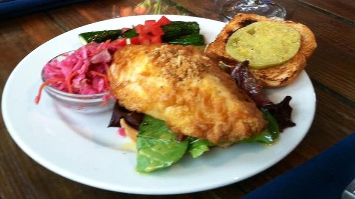 The “GLT” at Blue Marlin AMI features fresh grouper, “Fulford” style with fried green tomato, baby greens dressed with orange sunshine and served with vegetables. The restaurant is at 121 Bridge Street, Bradenton Beach.