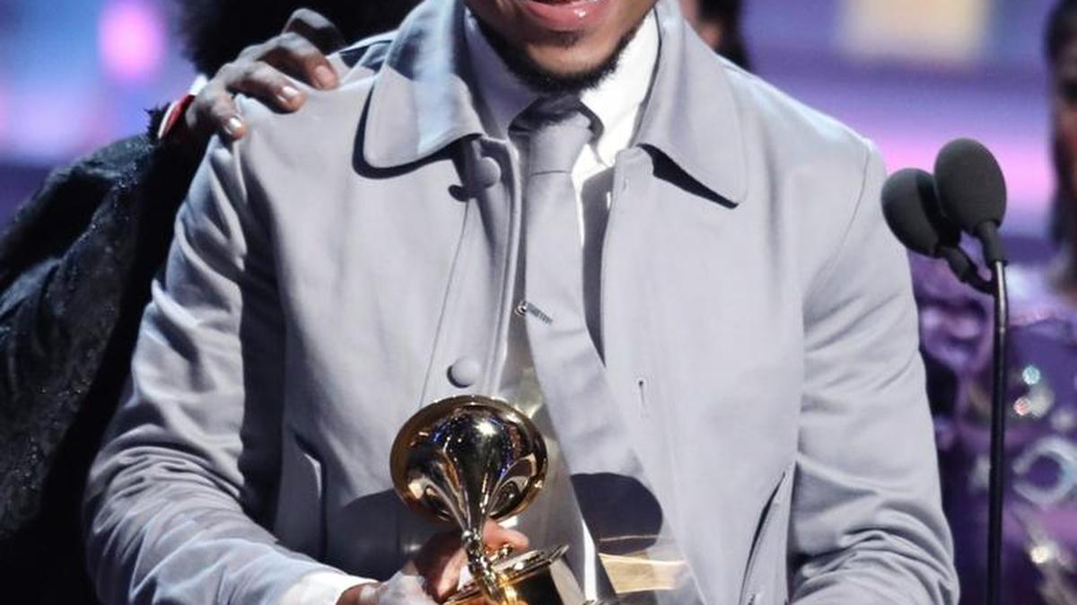 Chance The Rapper accepts the award for best rap album for “Coloring Book” at the 59th annual Grammy Awards on Sunday in Los Angeles.