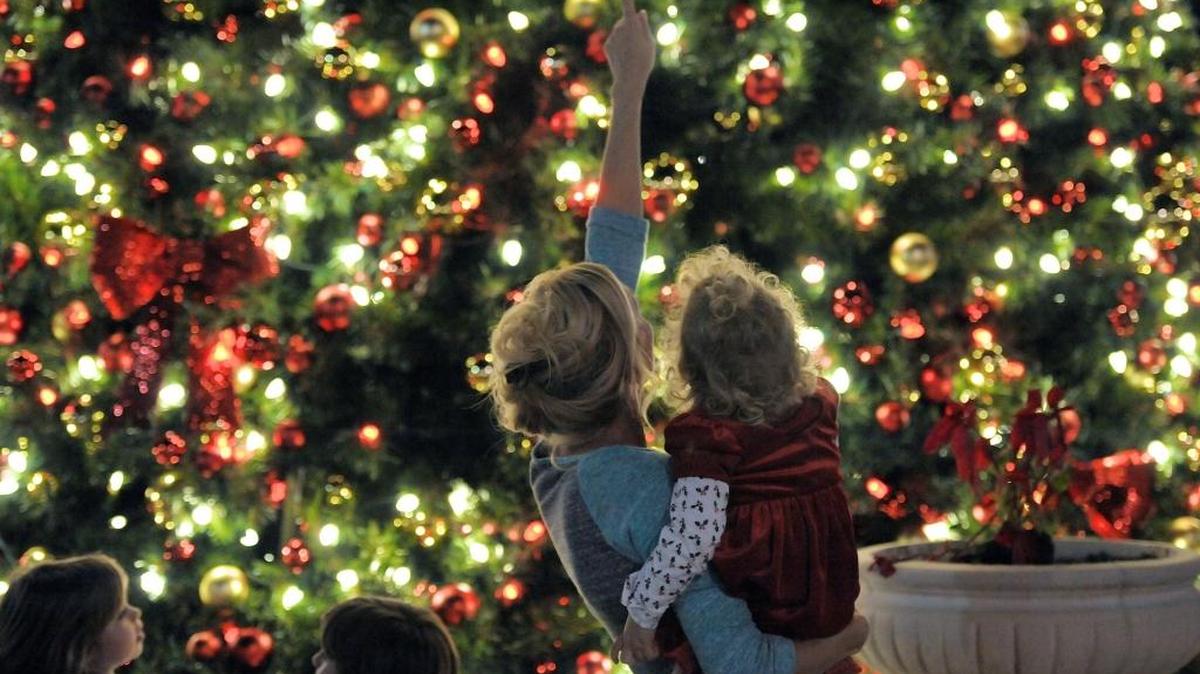 A mother and daughter celebrate the lighting of the tree at a past Holidays Around the Ranch on Main Street in Lakewood Ranch.