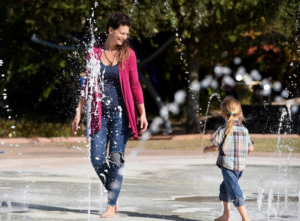 DeAdra Sunset and her almost-four-year old son, Dacian, play at Riverwalk. DeAdra left an abusive relationship to start over in Bradenton with her son.