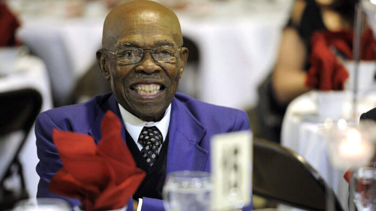 Coach Eddie Shannon smiles at a table at the Palmetto Youth Center's 20th annual Martin Luther King Banquet.
TIFFANY TOMPKINS-CONDIE/Bradenton Herald