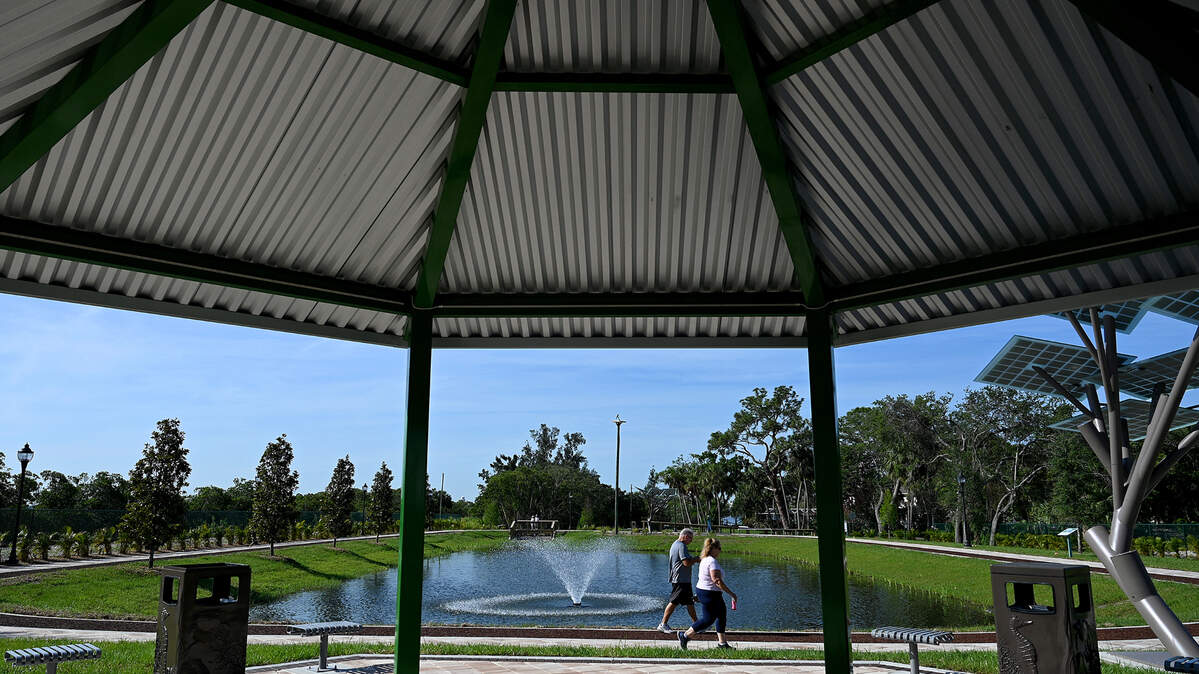 Ed and Kimberley Lee enjoy walking at Connor Park in Palmetto. The land was a brownfield remediation, and now provides filtering of runoff water in the area.