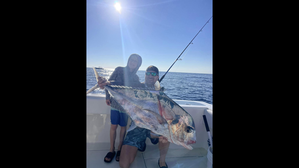 Anglers Jeremy Brongo and his son pose with a big African Pompano caught recently in the Gulf of Mexico 50 miles offshore of Anna Maria Island.