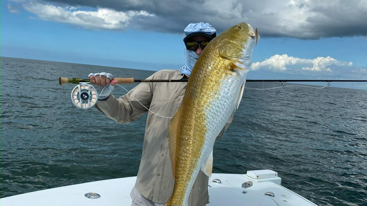 Cody Chivas with a redfish caught and released in the Gulf of Mexico.