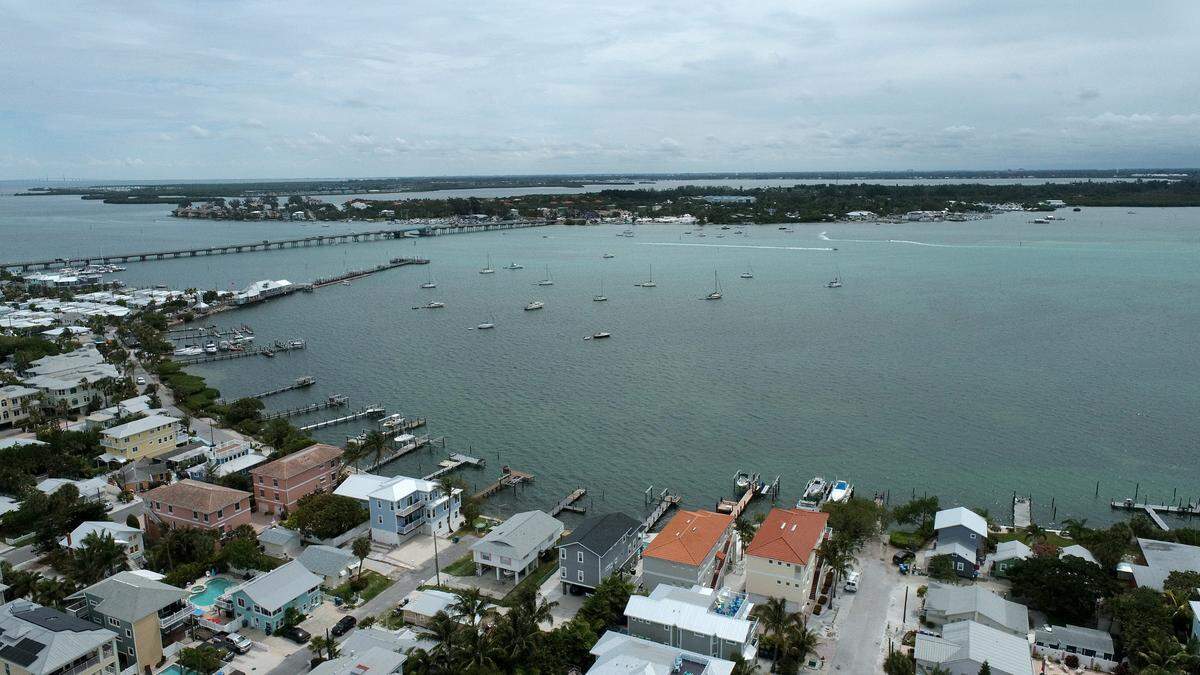 Rain bands from a tropical disturbance impacting South Florida had not made their way to Manatee County beaches mid-morning Friday. The National Hurricane Center is forecasting the system to slightly strengthen into a tropical storm. Intracoastal waterway in Bradenton Beach looking East.