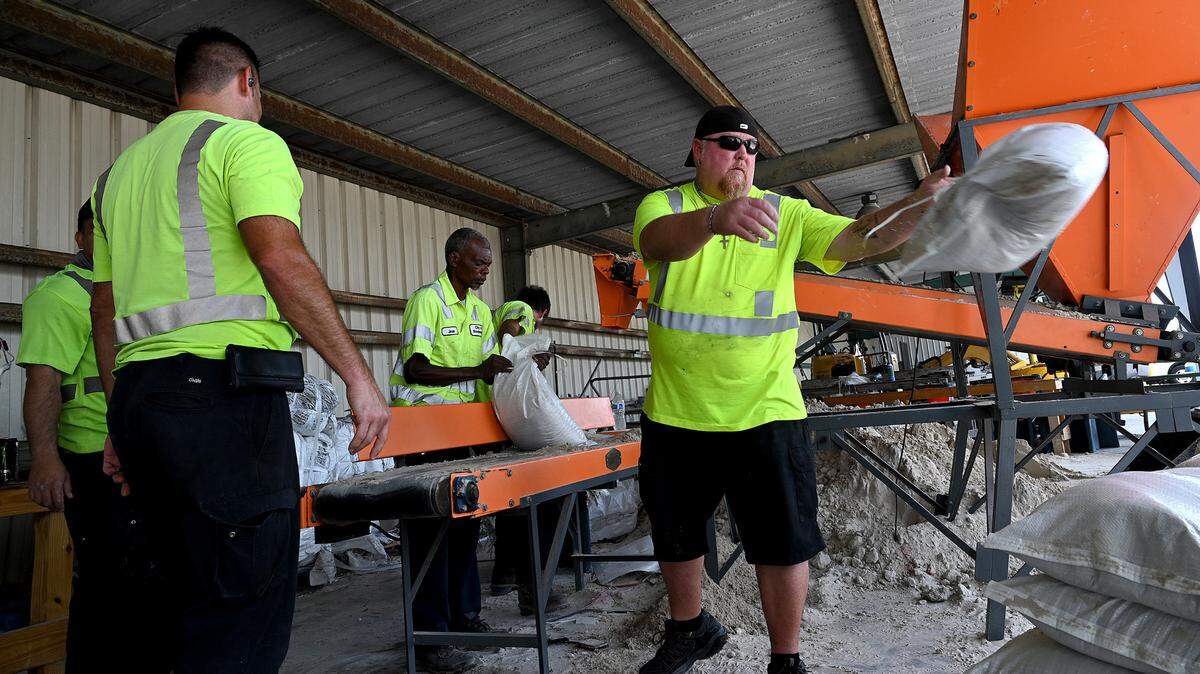 City of Bradenton employees fill sandbags for residents in preparation for Idalia’s expected strengthening and approach on August 28, 2023.