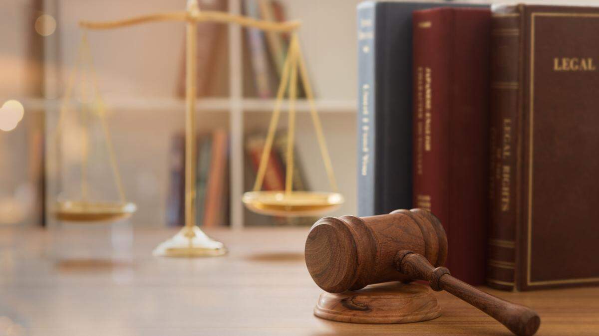 Judge gavel with law books and scales of justice. concept of justice, legal, jurisprudence. wide view.