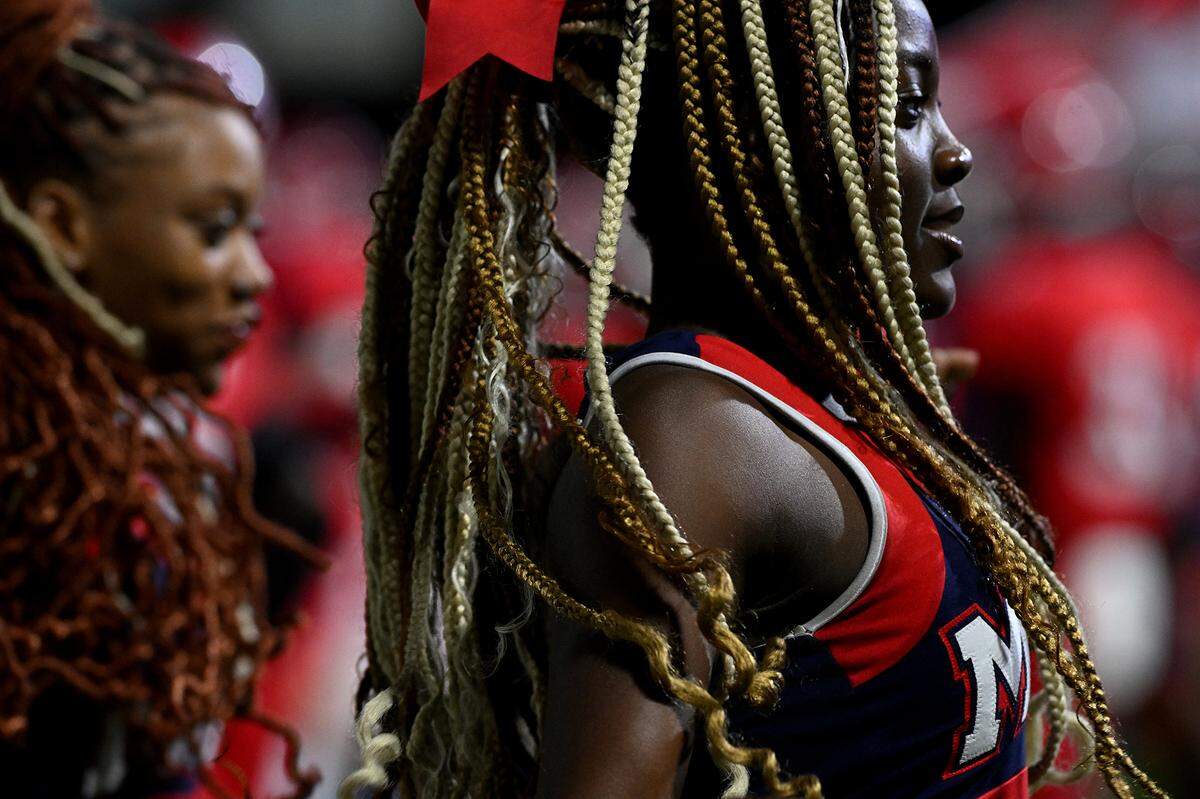 A Manatee cheerleader dances with teammates at Joe Kinnan Field at Hawkins Stadium on Friday, Nov. 17, 2023.