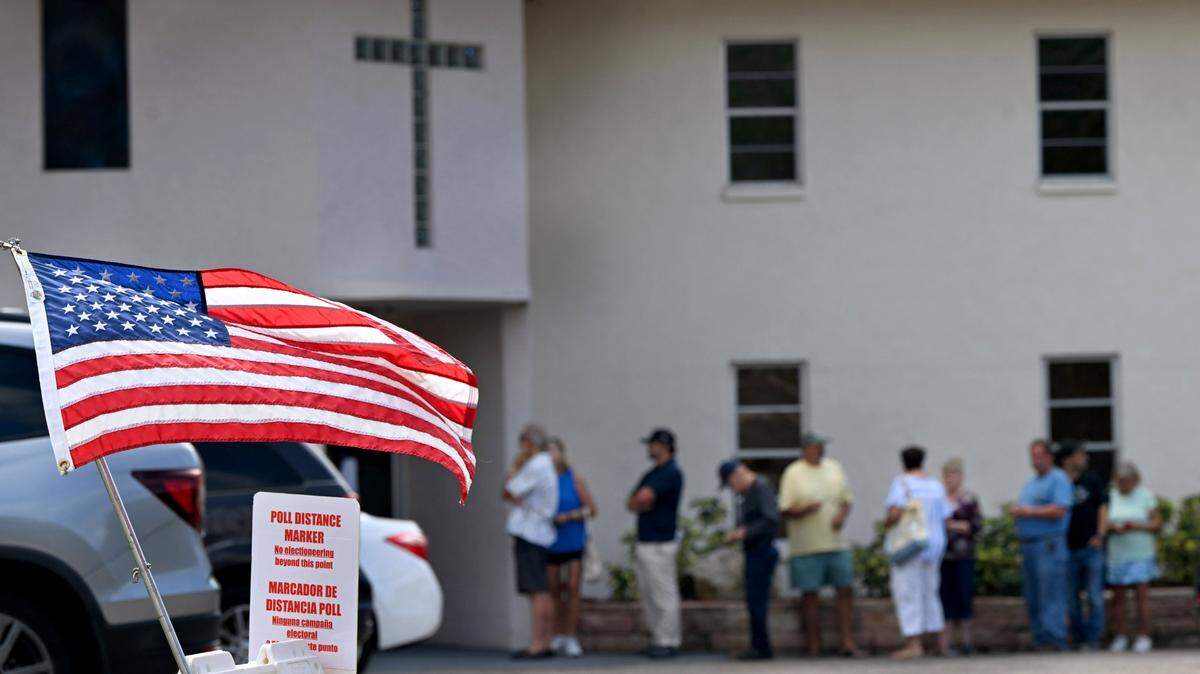 A line of voters waits outside the Church of Hope in Palmetto on Nov. 5, 2024.