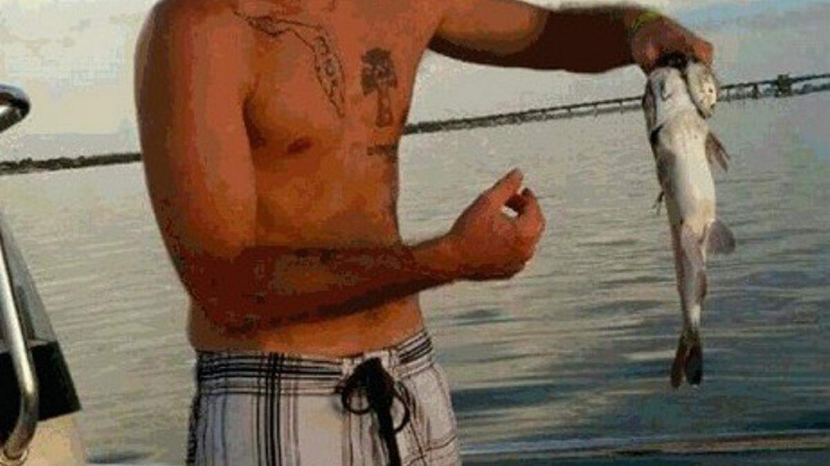 Bobby Lee, who was 28 when he died of a heroin overdose on Aug. 7, holding up a fish he caught off Anna Maria Island. Provided photo