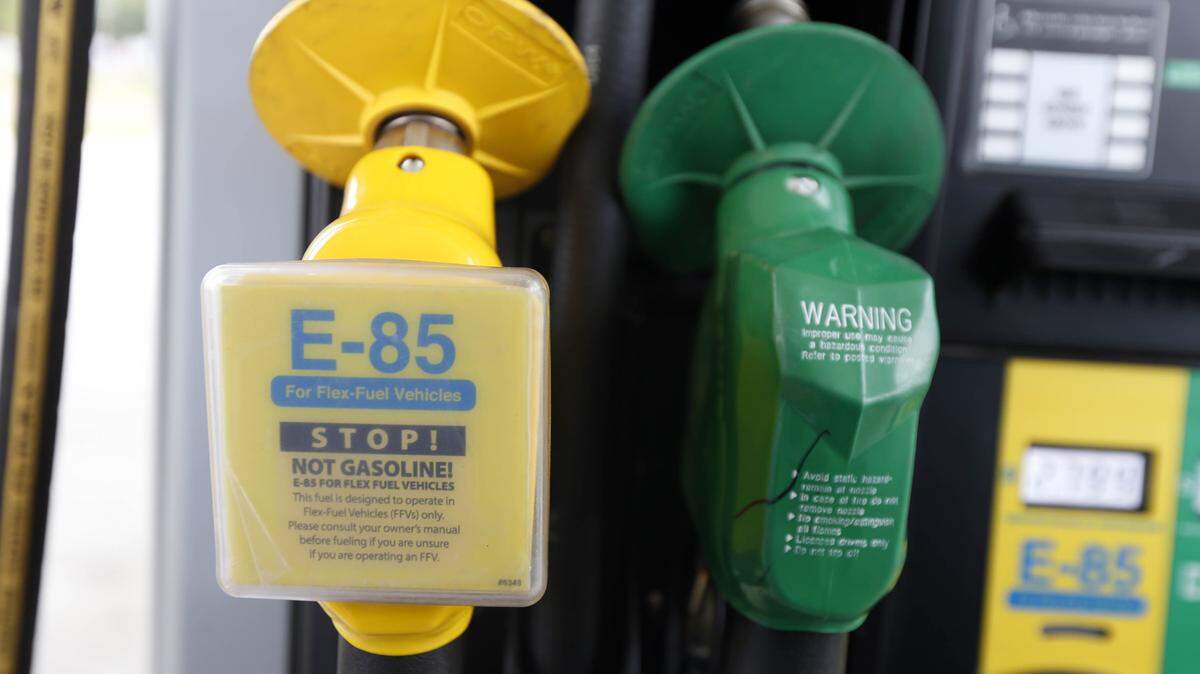 FILE - In this Aug. 9, 2014 file photo, a fuel nozzle for E-85, left, and traditional gasoline is seen at a gas station in Batesville, Miss. The Obama administration is boosting the amount of corn-based ethanol and other renewable fuels in the U.S. gasoline supply. That's despite sustained opposition by an unusual alliance of oil companies, environmentalists and some GOP presidential candidates. (AP Photo/Rogelio V. Solis, File)