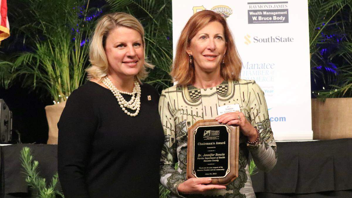 6/24/2021--Jacki Dezelski, left, presented the Manatee Chamber of Commerce’s Chairman’s Award to Dr. Jennifer Bencie, Manatee County health officer, for her leadership during the pandemic.
