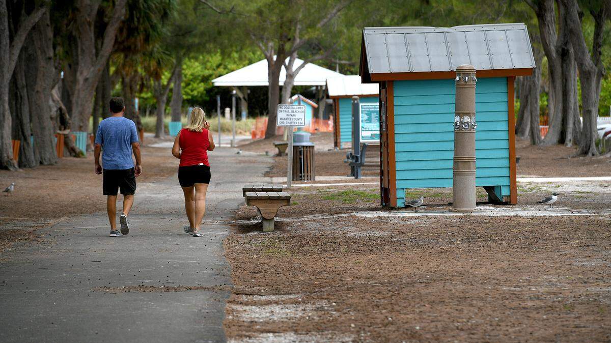 The trail along Coquina Beach near the North Coquina parking lot where visitors can enjoy a bit of shade from the Australian pines, trees that have been the subject of much debate. There are also many picnic tables along the trail.