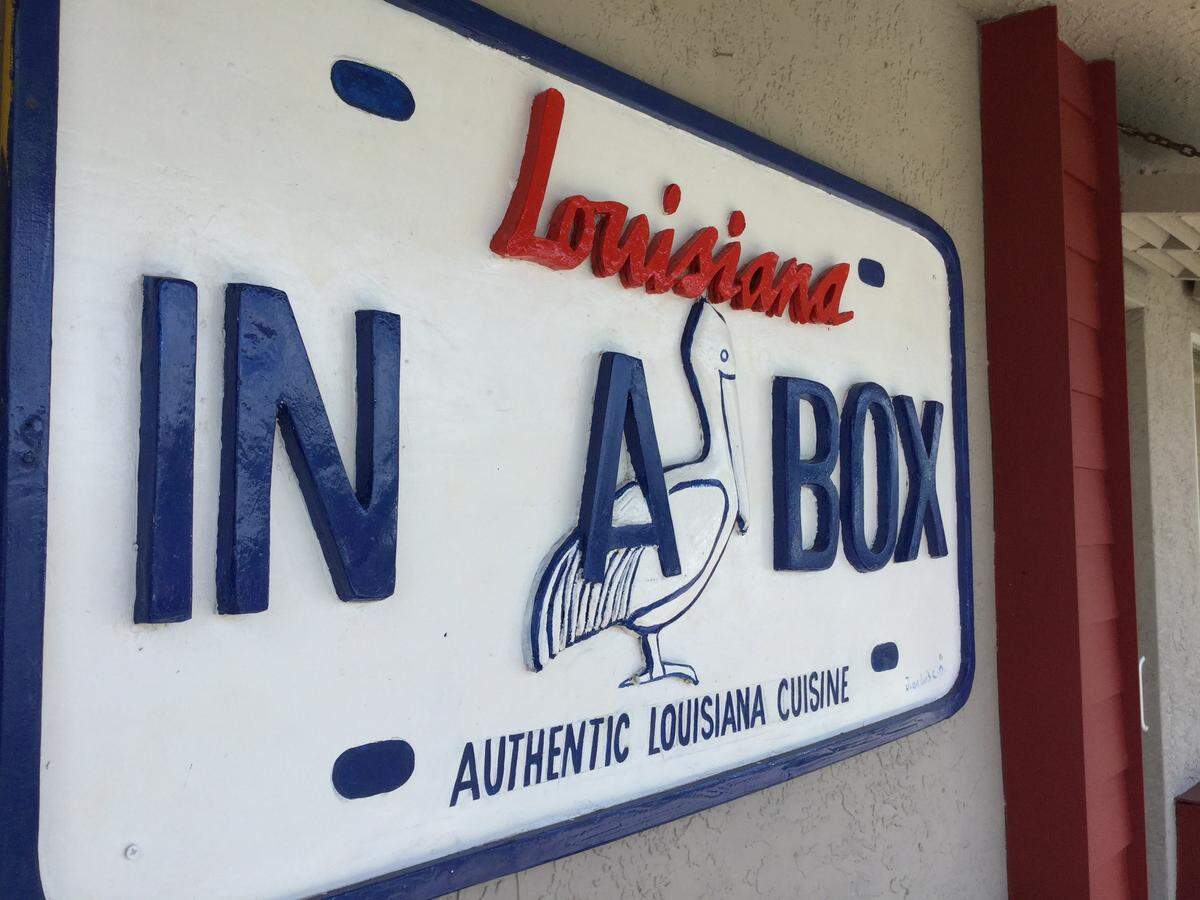 The sign reads a new restaurant is coming to Palmetto, but the owners are almost as mysterious as the legacy of the building they hope to soon occupy.