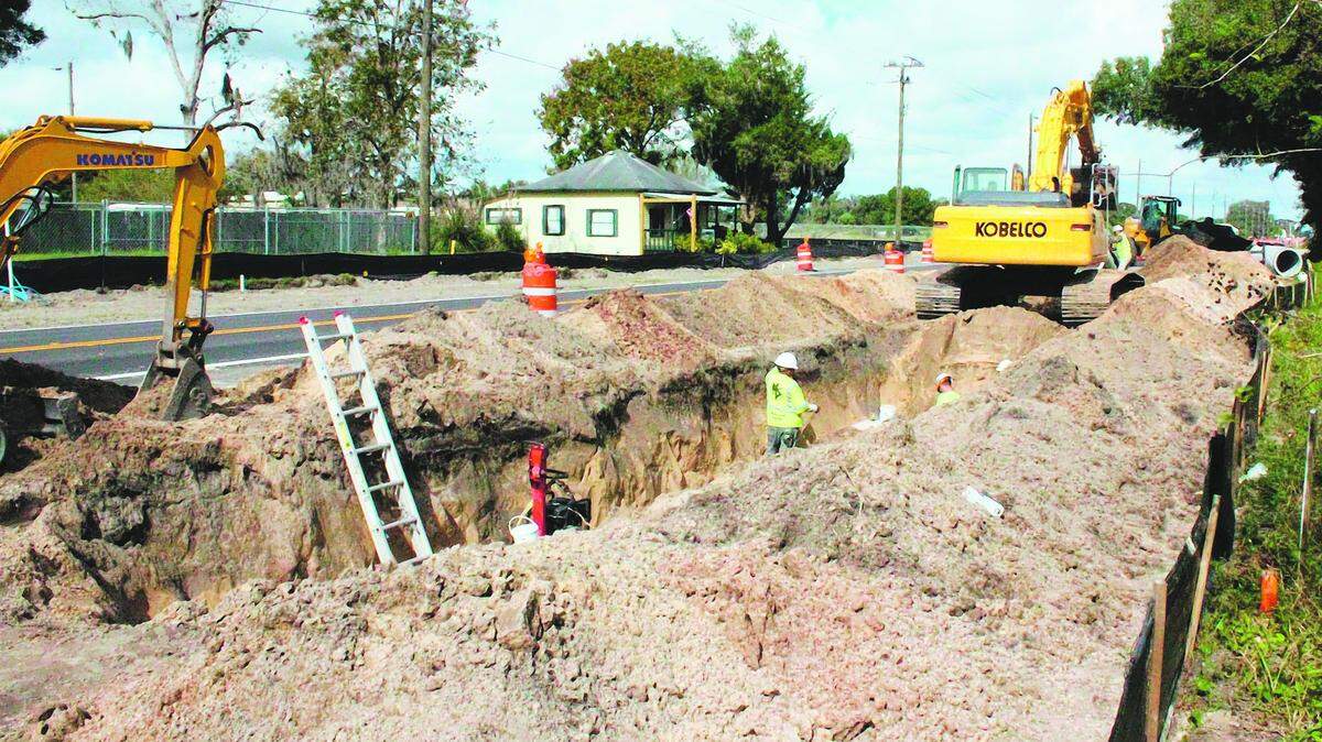 Workers make drainage improvements along U.S. 301 in Parrish. The highway is being four-laned between Moccasin Wallow Road and County Road 675. 
 JAMES A. JONES JR./Bradenton Herald