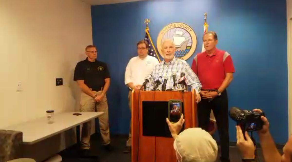 Members of the media cover a press briefing before Hurricane Irma hit in September 2017.