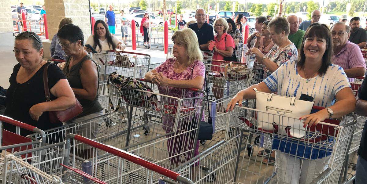 Elaine Noce, right, awaits the opening of the the new Bradenton Costco Wholesale warehouse on Wednesday at Heritage Harbour.