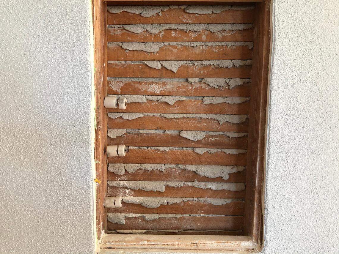 3/4/2021--Renovation of the auditorium is the focus of efforts at the historic 1914 Myakka City school, 10060 Wauchula Road. Shown above is some of the original lathe-and-plaster construction, along with the knob-and-tube wiring system that was installed about 1948.