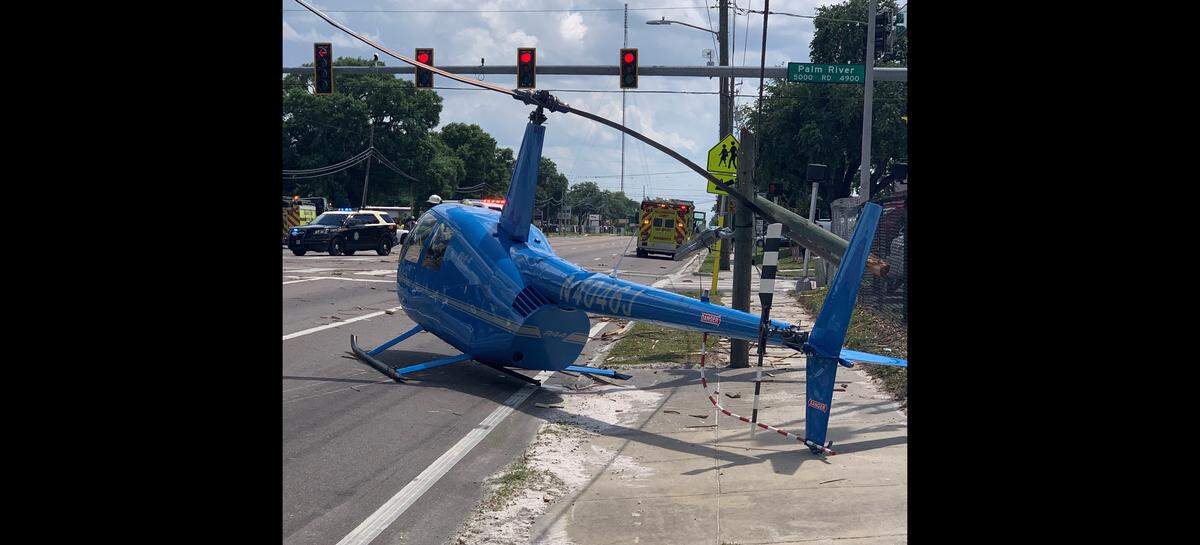 A helicopter crash landed on a busy Hillsborough County road Thursday, killing a passenger in a pickup truck.