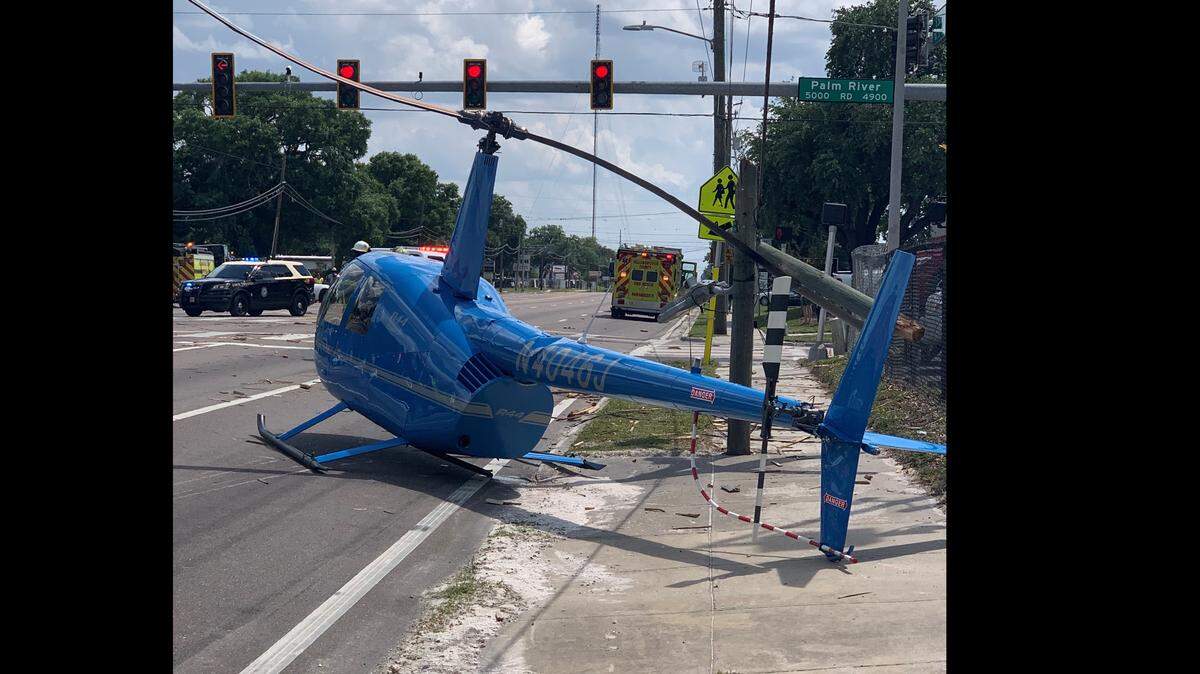 A helicopter crash landed on a busy Hillsborough County road Thursday, killing a passenger in a pickup truck.