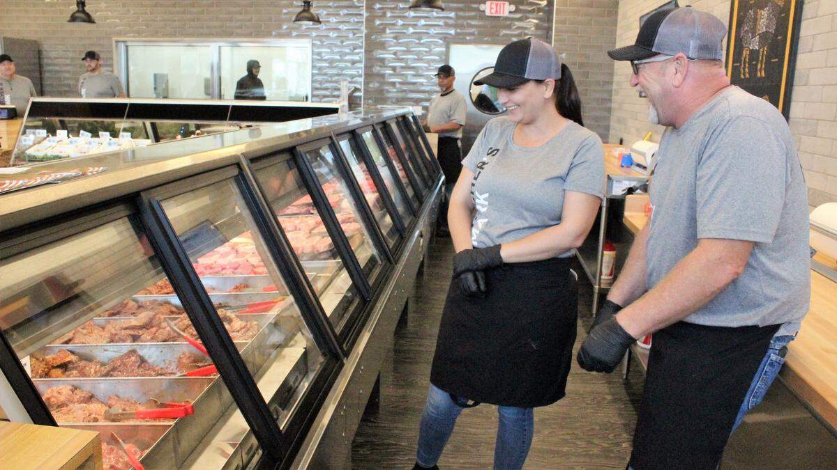 Tiffany Sielaff and Wayne Spiekhout are two of the staff members at Butcher’s Mark, 8519 Cooper Creek Blvd., University Park. The store, which opened Wednesday, offers prime cuts of meat and 20 varieties of marinade.