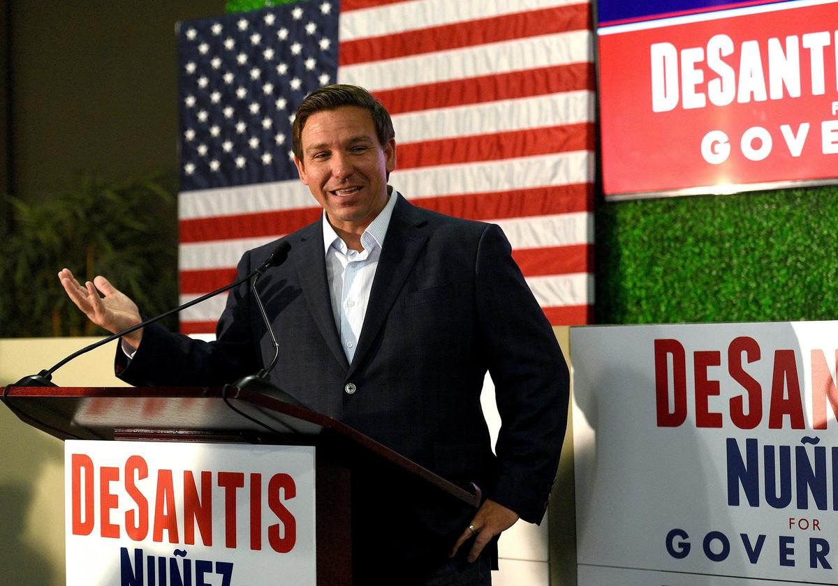 Republican candidate for governor, Ron DeSantis, talks to a crowd during a campaign rally stop at Dolphin Aviation Wednesday morning.