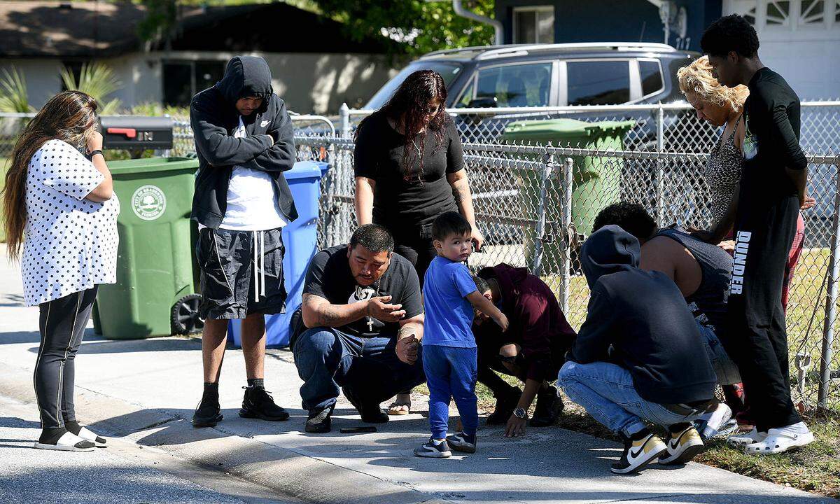 02/12/21--Friends and family of Antonio Aguirre, 20, mourn his loss where he was fatally shot in a drive-by shooting in the 700 block of 25th Street East Thursday night.