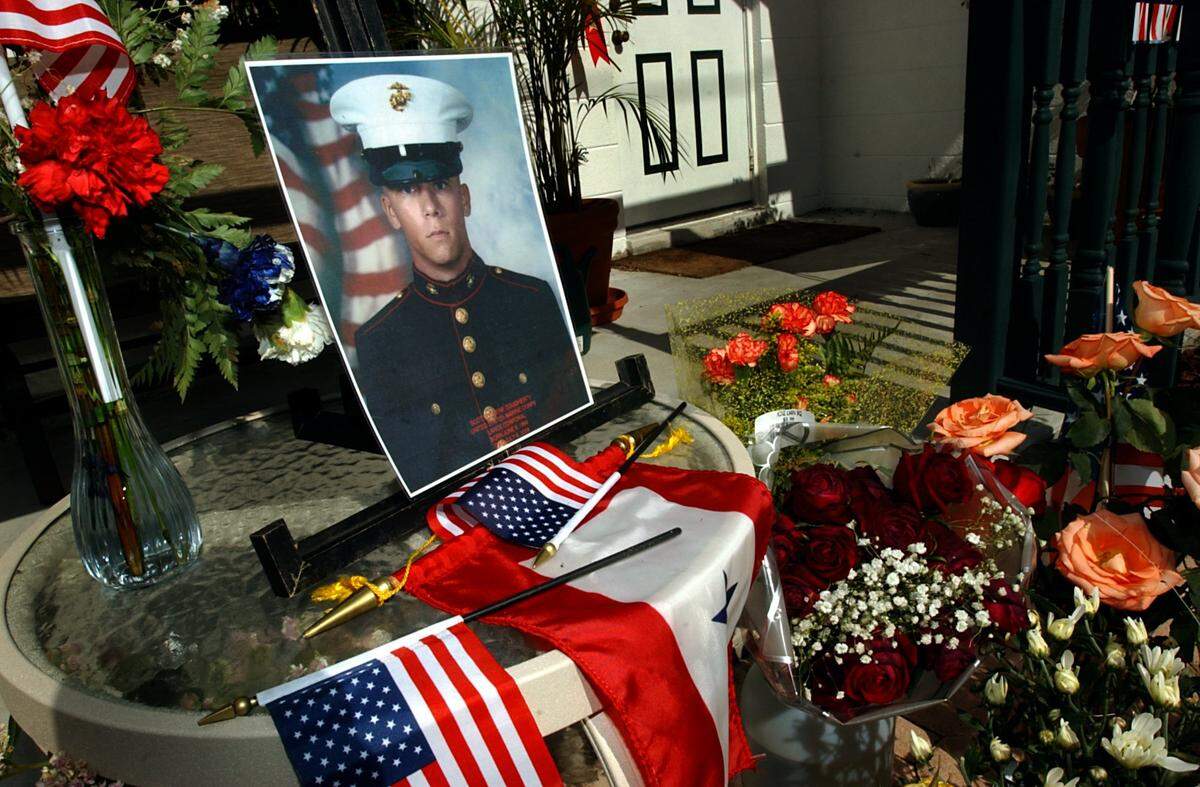 The mailbox in front of Scott Dougherty’s father’s Manatee County home, which started out Wednesday with a welcome home banner for the fallen Marine, had turned into a small memorial by Friday evening, July 9, 2004. Lance Cpl. Dougherty, a 2002 Bayshore High graduate, was killed in action in Iraq on Tuesday.