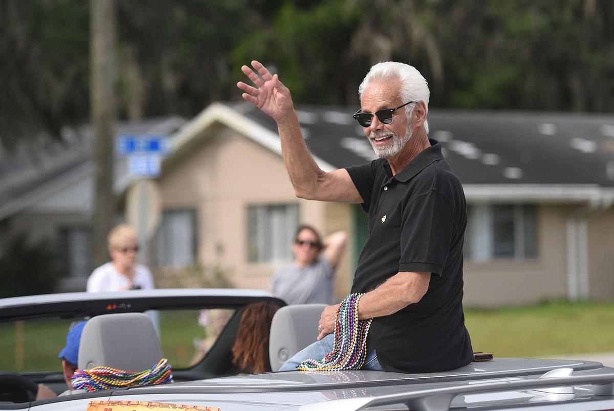 The Most Distinguished Citizen, Charles Clapsaddle, waves during the annual DeSoto Children’s Parade in Palmetto.
