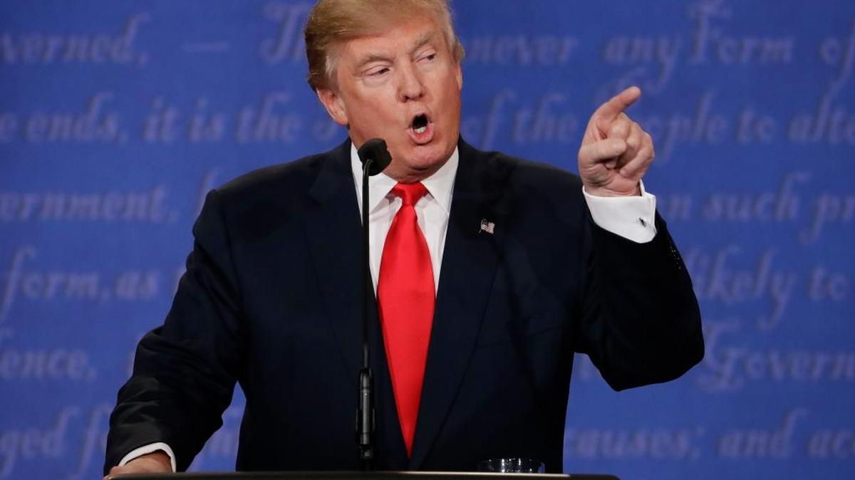 Republican presidential nominee Donald Trump speaks Wednesday to Democratic presidential nominee Hillary Clinton during the third presidential debate at UNLV in Las Vegas.