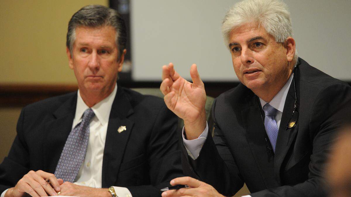 Rep. Jim Boyd leads a roundtable discussion with community leaders Wednesday at the Manatee County Administration Building, regarding the heroin epidemic in the area. At right participating in the discussion is Rep. Julio Gonzalez. 
 GRANT JEFFERIES/Bradenton Herald