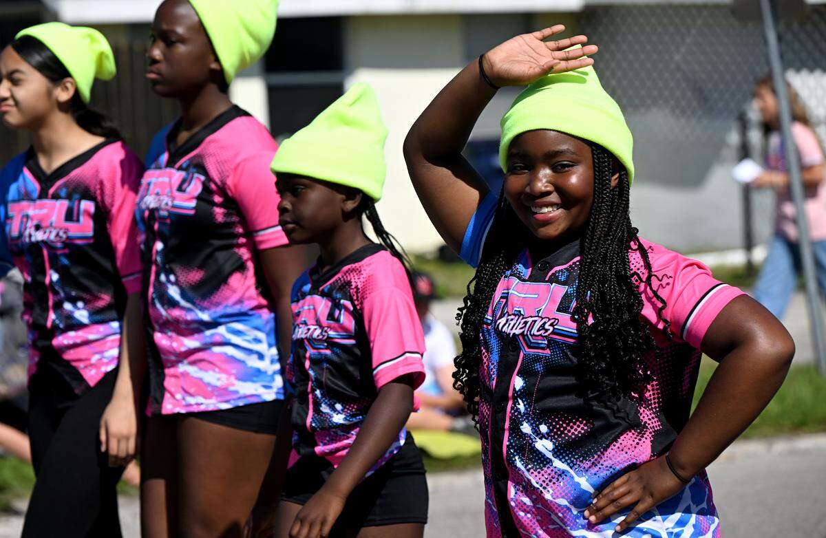 Marchers smile and wave in the annual DeSoto Children’s Parade and Party in the Park in Palmetto on April 18, 2025.