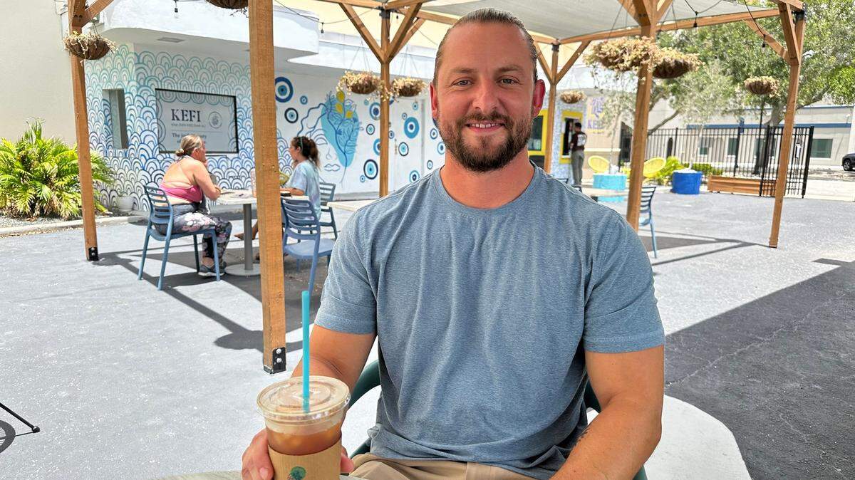 Jason Simpson, shown 5/22/2024, opened Kefi Streetside Cafe in 2021 with Eleni Sokos in a former drive-up bank teller space. The cafe is closing May 25 but will reopen inside the Central Connect building in downtown Bradenton in October.